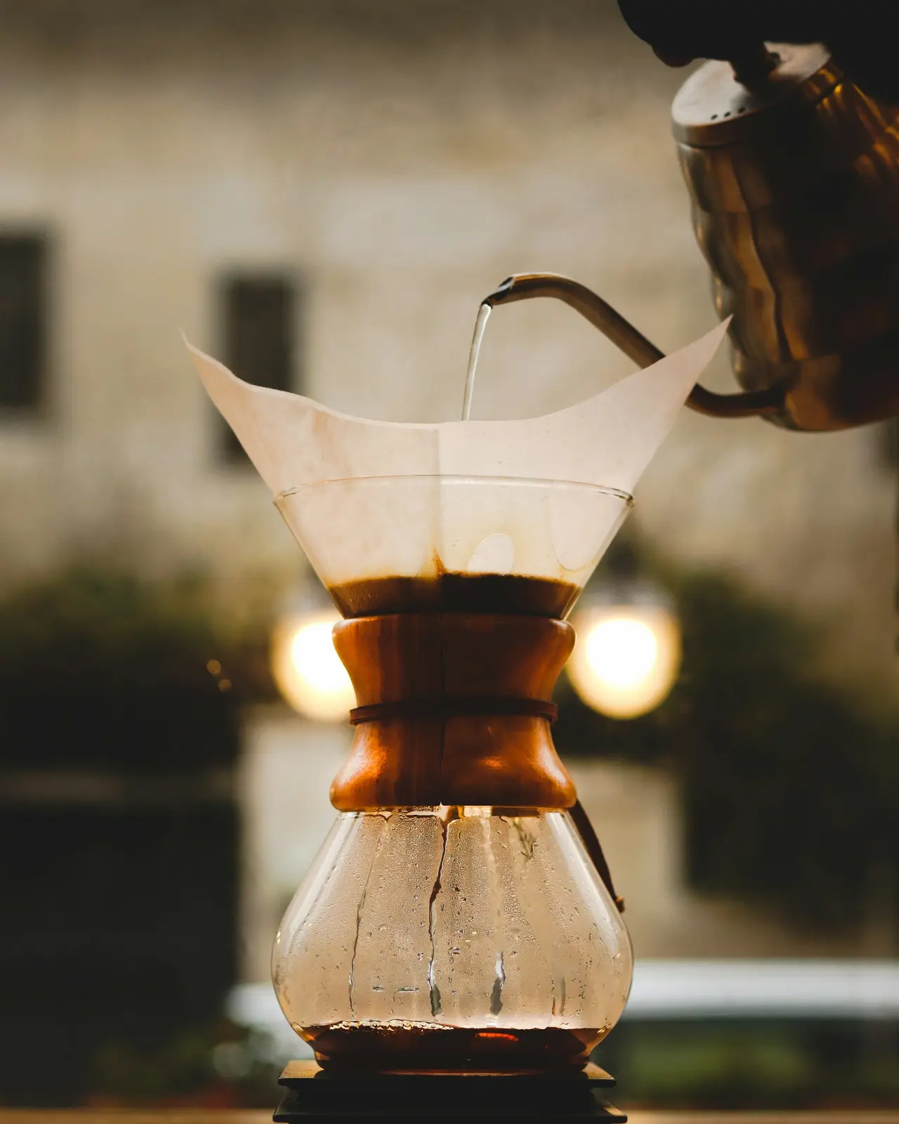 A Chemex coffee maker in warm morning light