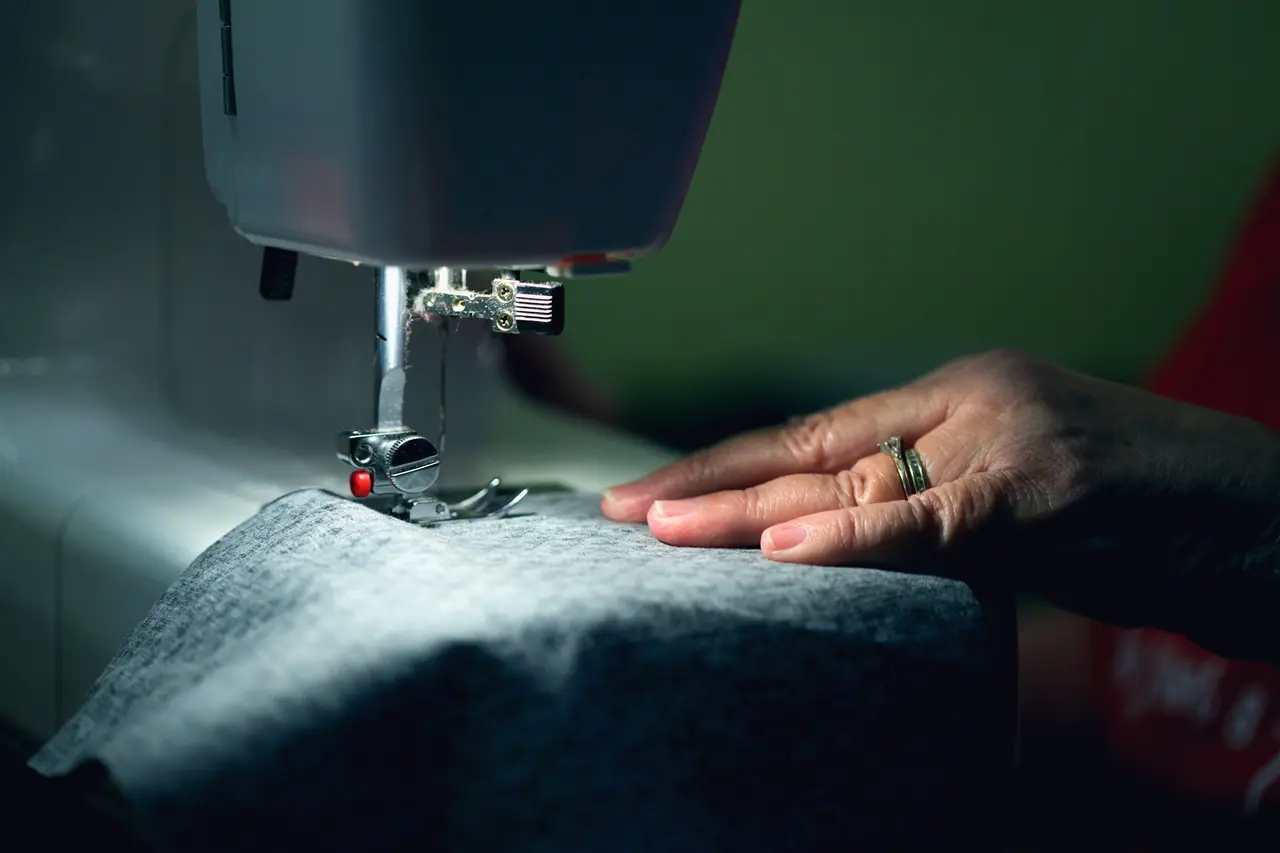 Denim fabric under a sewing machine needle