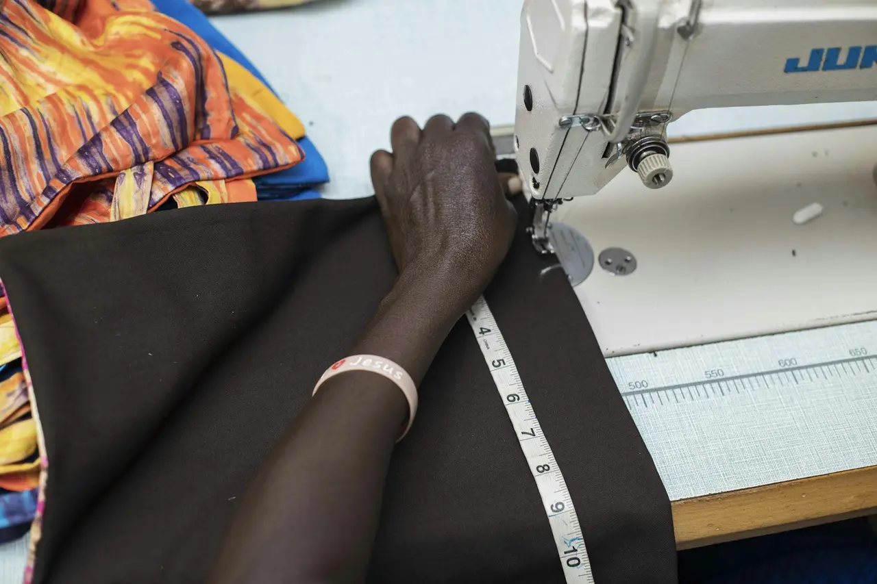 Measuring dark fabric on a cutting table